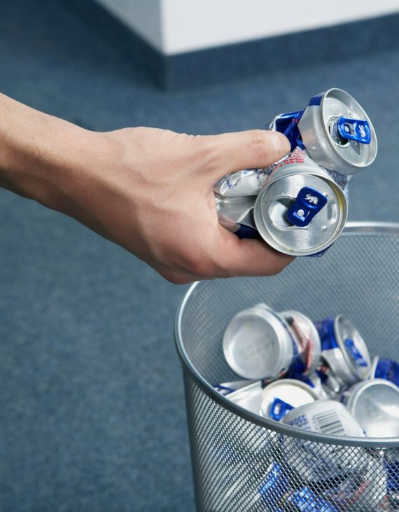 Cans being placed into bin